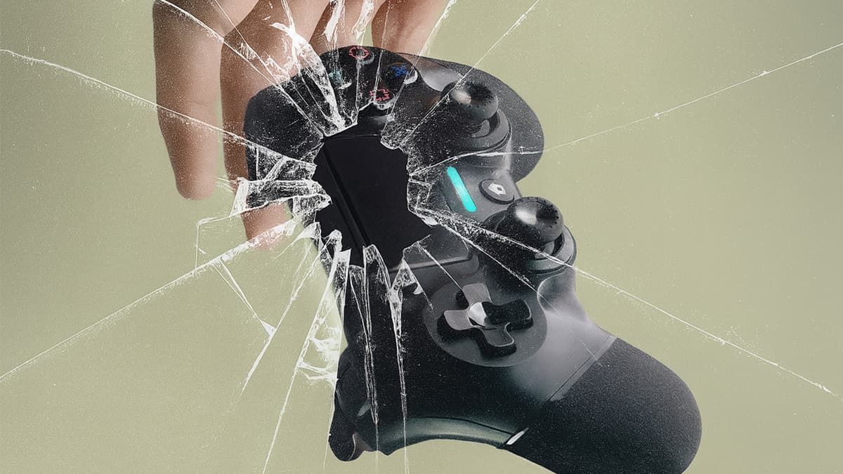 A falling game controller with a broken glass effect.
