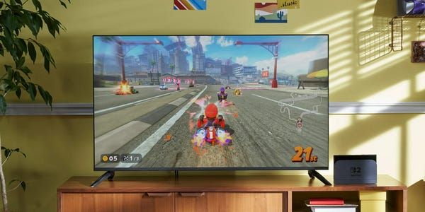 a tv screen showing mario kart world being played on the nintendo switch 2